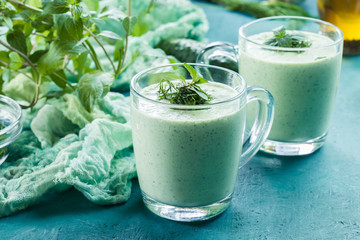 Cold cucumber soup with dill and mint served in glassful. Summer dish