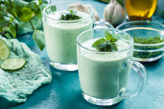Cold cucumber soup with dill and mint served in glassful. Summer dish