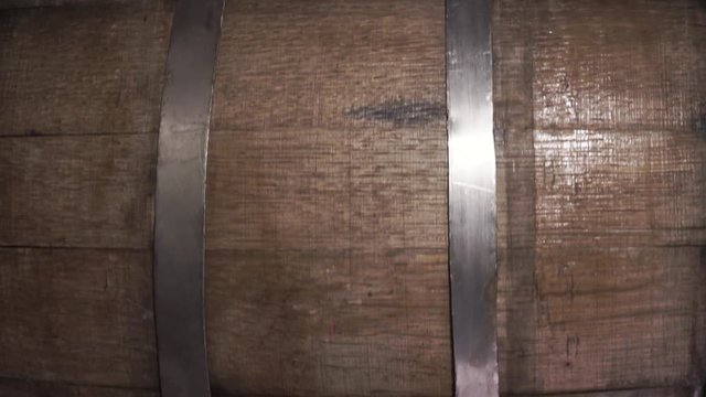Background of barel on a wooden table, rotation 360 degrees. Beautiful dark background.	