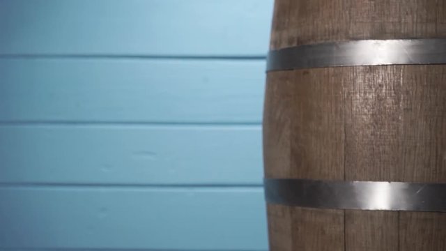 Background of barel on a wooden table, rotation 360 degrees. Beautiful  blue wooden background.	