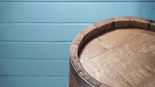 Background of barel on a wooden table, rotation 360 degrees. Beautiful  blue wooden background.	