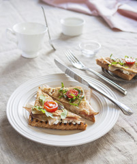 Toasted English bacon & egg a white background