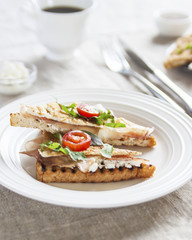 Toasted English bacon & egg a white background
