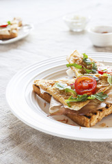 Toasted English bacon & egg a white background