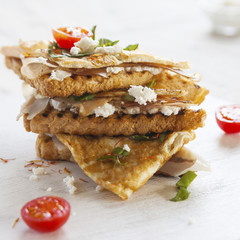 Toasted English bacon & egg a white background