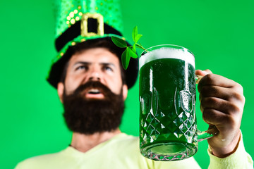 Green beer. Bearded leprechaun with green beer. Green men hat or top hat. St Patricks Day. Ireland...