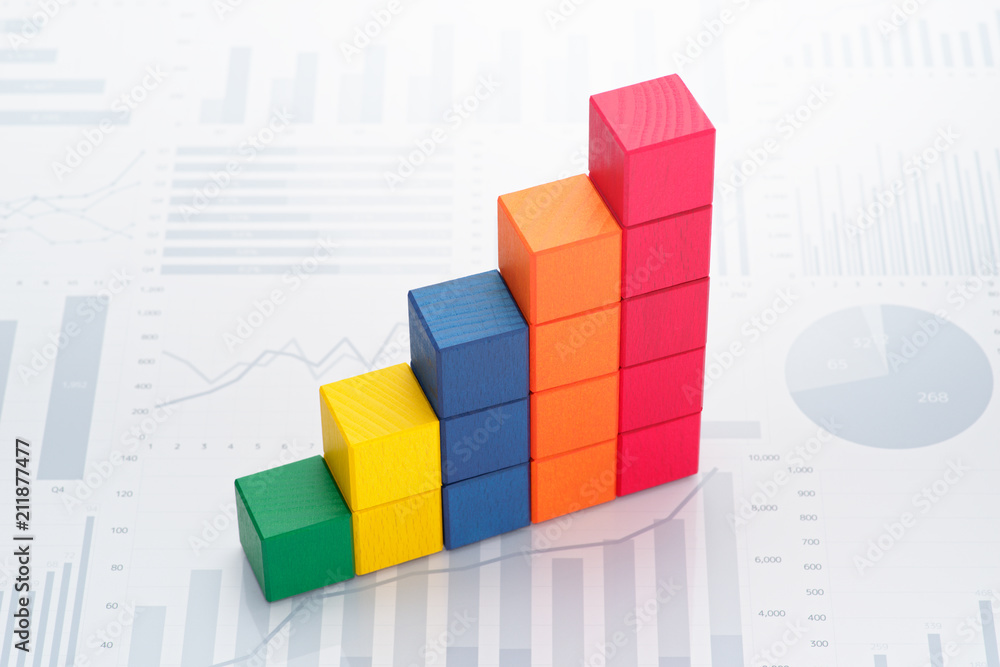 Poster Statistical data analysis. Business data processing. Colorful toy block steps on many charts and graphs background.
