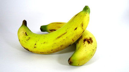 Bananas are dirty on a white background.
