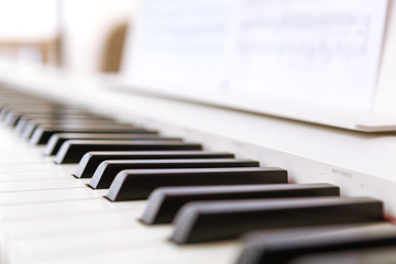 Close up of black and white piano keys.