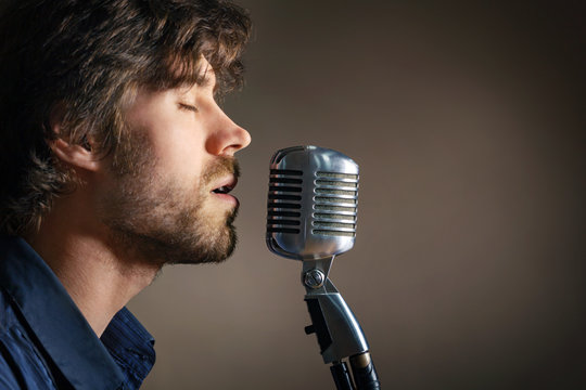 Handsome rock musician singing.