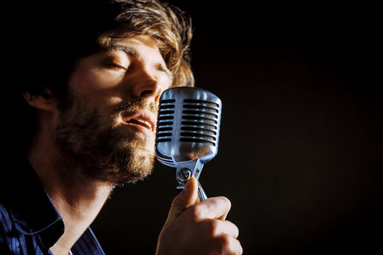 Handsome rock musician singing.