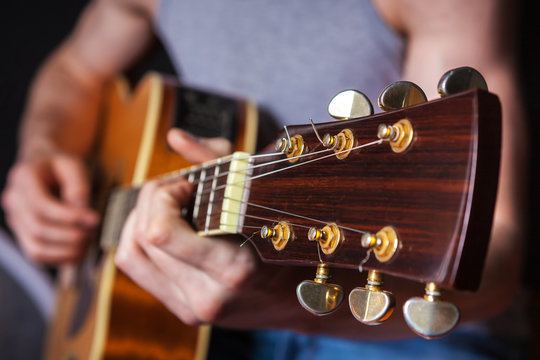 Rock guitarist practicing.