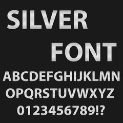 Font of silver color. English alphabet in silvery tones on a black background.