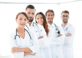 Fototapeta premium woman-pediatrician on the background of colleagues