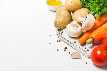 Mushrooms, potatoes and carrots on a white background. Set of fresh vegetables