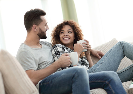 loving couple sitting on a sofa in the living room