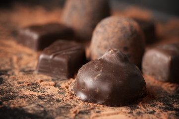 Assorted dark chocolate candies close-up