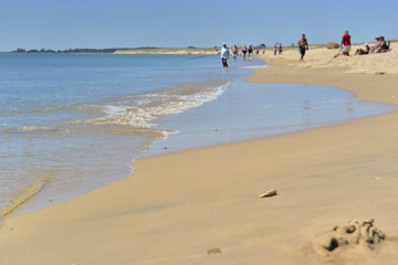 beach in resort with people far of  in Vendée - France
