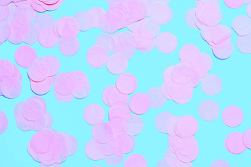 Pink confetti on blue background.