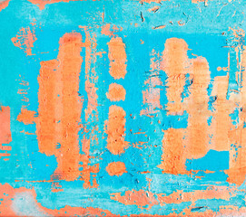 Old blue paint on rusty metal background