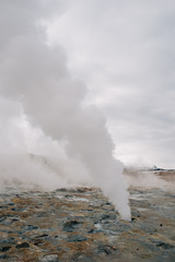 Fototapeta na wymiar Fumarole evacuating pressurized hot sulfurous gases from volcanic activity in the geothermal area of Hverir Iceland near Lake Myvatn