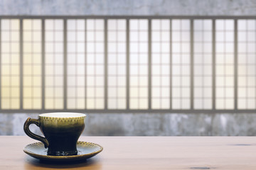 cup on wooden table