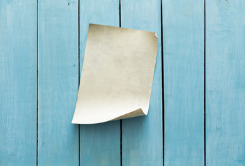 old paper on blue wall