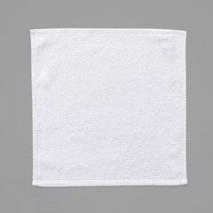 White cotton towel mock up template square size fabric wiper isolated on grey background with clipping path, flat lay top view
