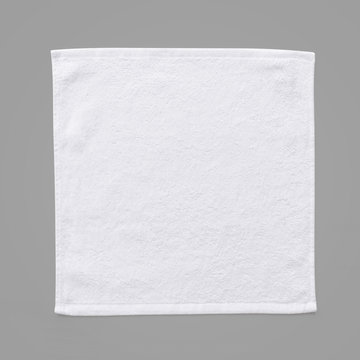 Fototapeta White cotton towel mock up template square size fabric wiper isolated on grey background with clipping path, flat lay top view