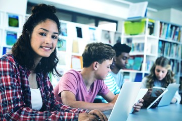 Students using laptop, digital tablet