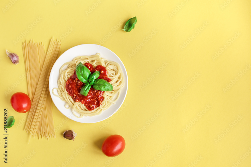 Wall mural spaghetti pasta on yellow background