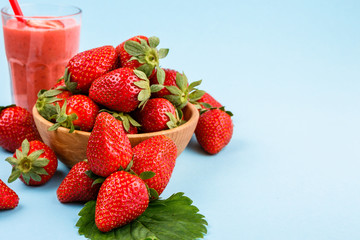 fresh strawberrysmoothie or milkshake on a delicately blue background