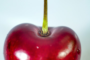 part of cherry macro berries on white background