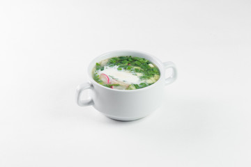okroshka in a white plate on a white background