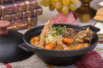 Traditional thick soup made from sauerkraut with pork, smoked pork ribs, sausages, capers and lemon.