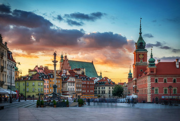 Royal Castle, ancient townhouses and Sigismund's Column in Old town in Warsaw, Poland. Evening...