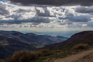 Obraz premium Granada, Spain; May 04, 2018: Mountains landscape with clouds in the sky in Granada