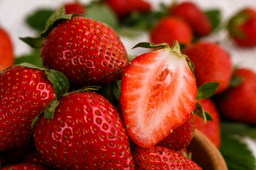 Juicy fresh strawberry on a rustic wooden background