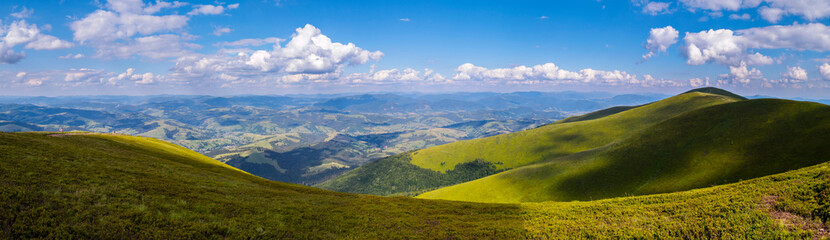 Fototapeta na wymiar panorama of mountain peaks and forest plains