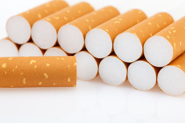 A cigarette filter for smoking on a white background.