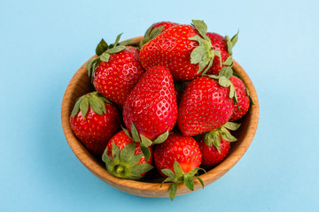 juicy fresh strawberry on a delicately blue background