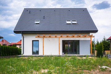 Newly built house with a finished plaster and paint