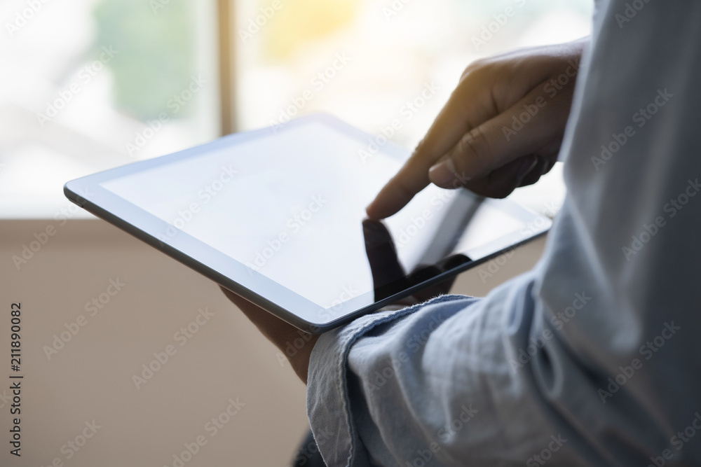 Poster digital tablet computer close up man using tablet hands man multitasking with isolated screen