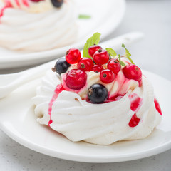 Pavlova meringue cake with fresh berries.