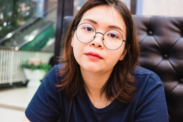 Close up of young Asian woman in the restaurant.