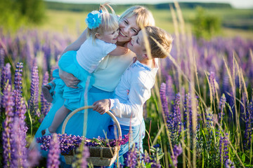 mom with kids in the field