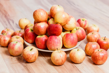 a large plate of red apples