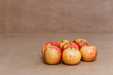 yellow and red apples on a brown background