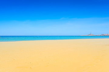Fototapeta na wymiar European sandy beach and blue sea.