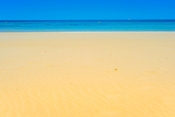 European sandy beach and blue sea.